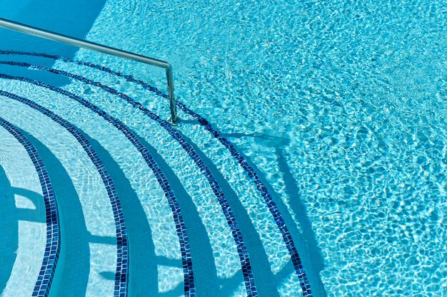 Swimming pool with stairs seen from above