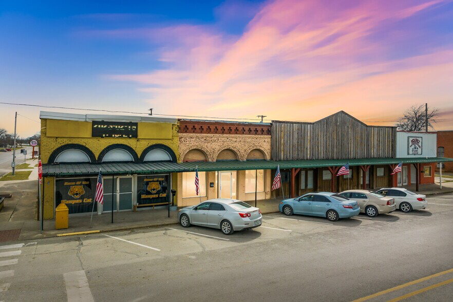 Old store next to a parking lot in Itasca